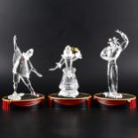 Three limited edition Swarovski figures.