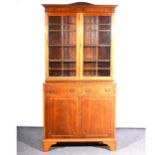 A reproduction mahogany bookcase, ...