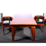 A contemporary honey stained beechwood dining table, ...