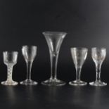 An antique bell shaped ale glass, and four others.