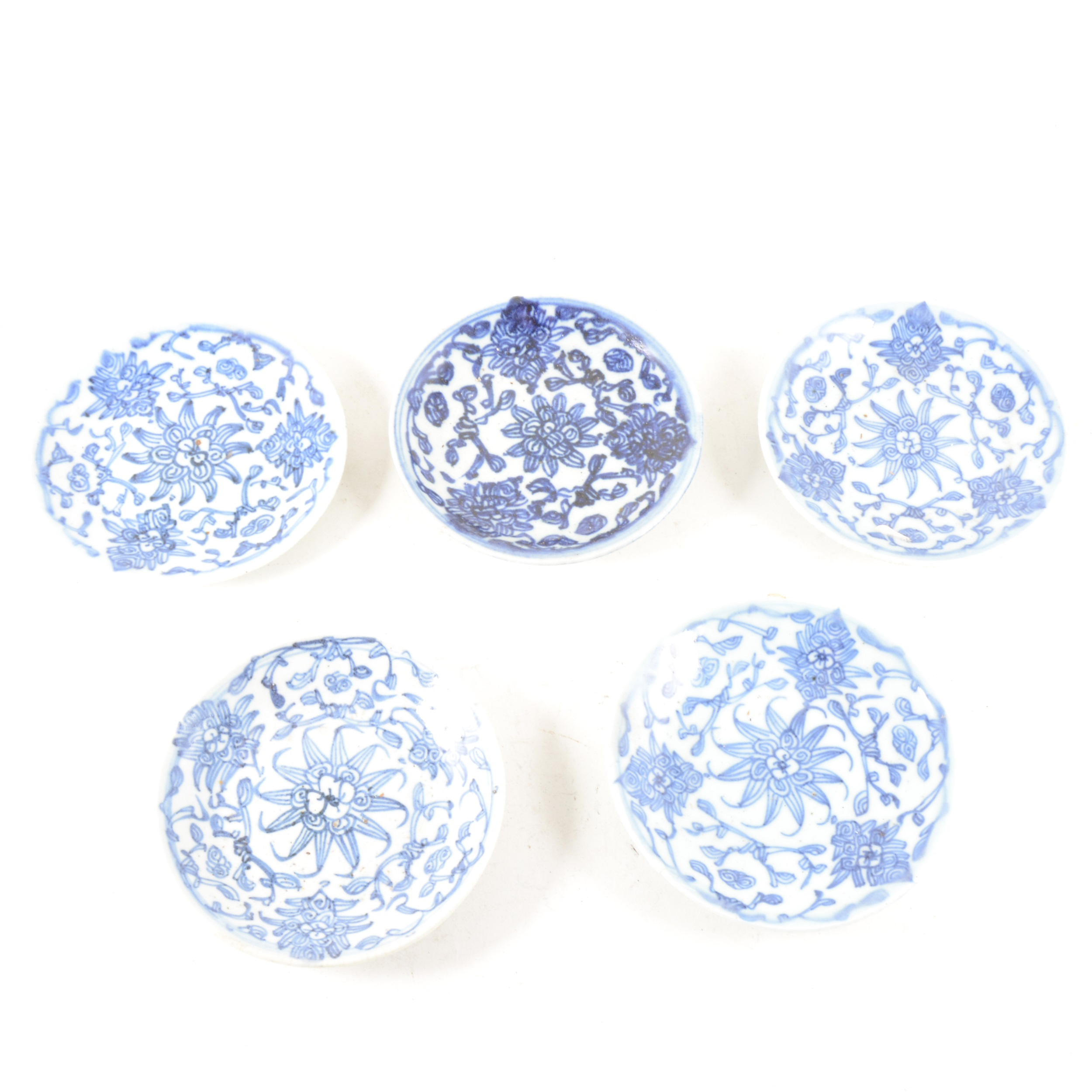 A collection of Chinese Tongxi blue and white saucers, ...