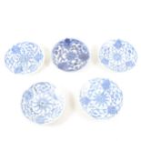 A collection of Chinese Tongxi blue and white saucers, ...