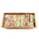 A set of puzzle blocks, one side depicting Generals of the British Army, battle scenes on other