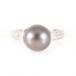 A Tahitian pearl and diamond ring, diamond shoulders setting.
