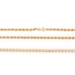 A fine gold bracelet and rope design necklace.