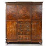 A mahogany part-fitted breakfront wardrobe, ...