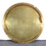 A large circular brass pan, ...