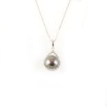 A Tahitian pearl and diamond pendant and chain