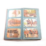 A postcard album and contents, World War I related, ...
