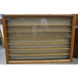 A modern stained pine wall hanging display cabinet, ...