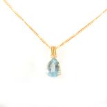 A blue topaz pendant and chain.