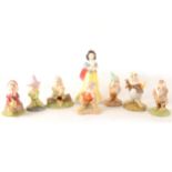 Eleven Royal Doulton 'Snow White and Seven Dwarfs Collection' figures, all boxed.