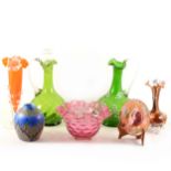 A collection of decorative glass, cranberry, green glass decanter and jug, fluted trumpet vase with