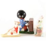 Three Guinness Royal Doulton figures, Coca Cola figures and a Carlton Ware Golly piano