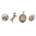 A collection of vintage silver jewellery, lockets, bangle, brooches.