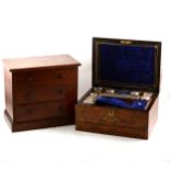 A Victorian figured walnut travelling case; and a miniature Victorian chest of drawers