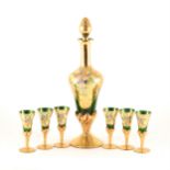 A Murano green glass and gilt overlaid liqueur set