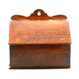 A Victorian oak candle box, hinged slope front
