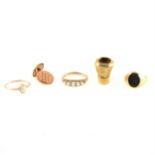 A collection of gold and yellow metal small jewellery items.