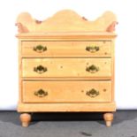 A pine chest of drawers,