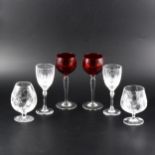 A collection of table glassware, including four Hock glasses with ruby bowls. (One box)