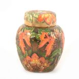 A 'Flames of the Forest' design ginger jar with lid, by Philip Gibson for Moorcroft Pottery, 1998.