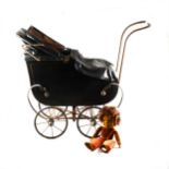 Victorian dolls pram and a Nora Welling black felt doll.