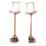 A pair of pitch pine floor standing lamps,