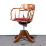 An oak swivel office chair,