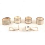 Four silver napkin rings and a spoon with pusher