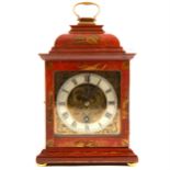 A red lacquered and chinoiserie decorated mantel clock, signed J.C. Vickery, London