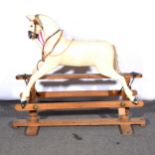 Line Bros Tri-ang rocking horse, on stand, white painted body, 133cm ful length of stand.