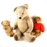 A large plush teddy bear, 80cm with jointed limbs and two smaller teddy bears.