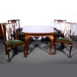 An Edwardian mahogany extending dining table,