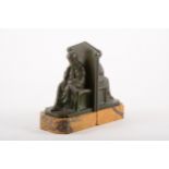 A pair of patinated bronze bookends sculpted as a seated lady