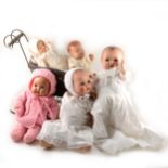 Five composition baby dolls, and a small sledge.