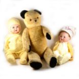 Two baby dolls, one Armand Marseille and another and a large plush teddy bear.