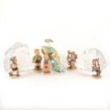A collection of decorative figures and Swedish glass paperweights