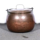 A large copper cauldron,