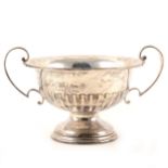 A silver pedestal twin handled bowl, Walker & Hall, Sheffield 1931