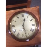 A Victorian mahogany wall clock