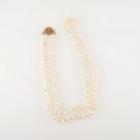 A cultured pearl rope necklace with 9 carat gold clasp.