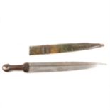 An North African knife, 41cm fullered blade, in a metal covered sheath.