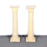 Two reconstituted stone Ionic column pedestals,