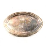 An oval silver platter, plain polished design, 50cm x 34cm, London 1964, makers mark KL,