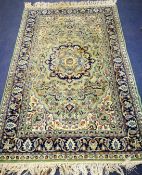 An Indian green carpet 196 x 124cm