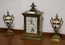 A Victorian and enamel clock garniture