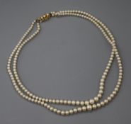 A double strand graduated cultured pearl necklace, with 9ct gold and cultured pearl clasp, 42cm.