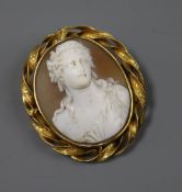 An early 20th century yellow metal mounted oval cameo brooch, carved with the bust of a lady, 46mm.