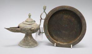 An Islamic bronze incense burner and an oil lamp